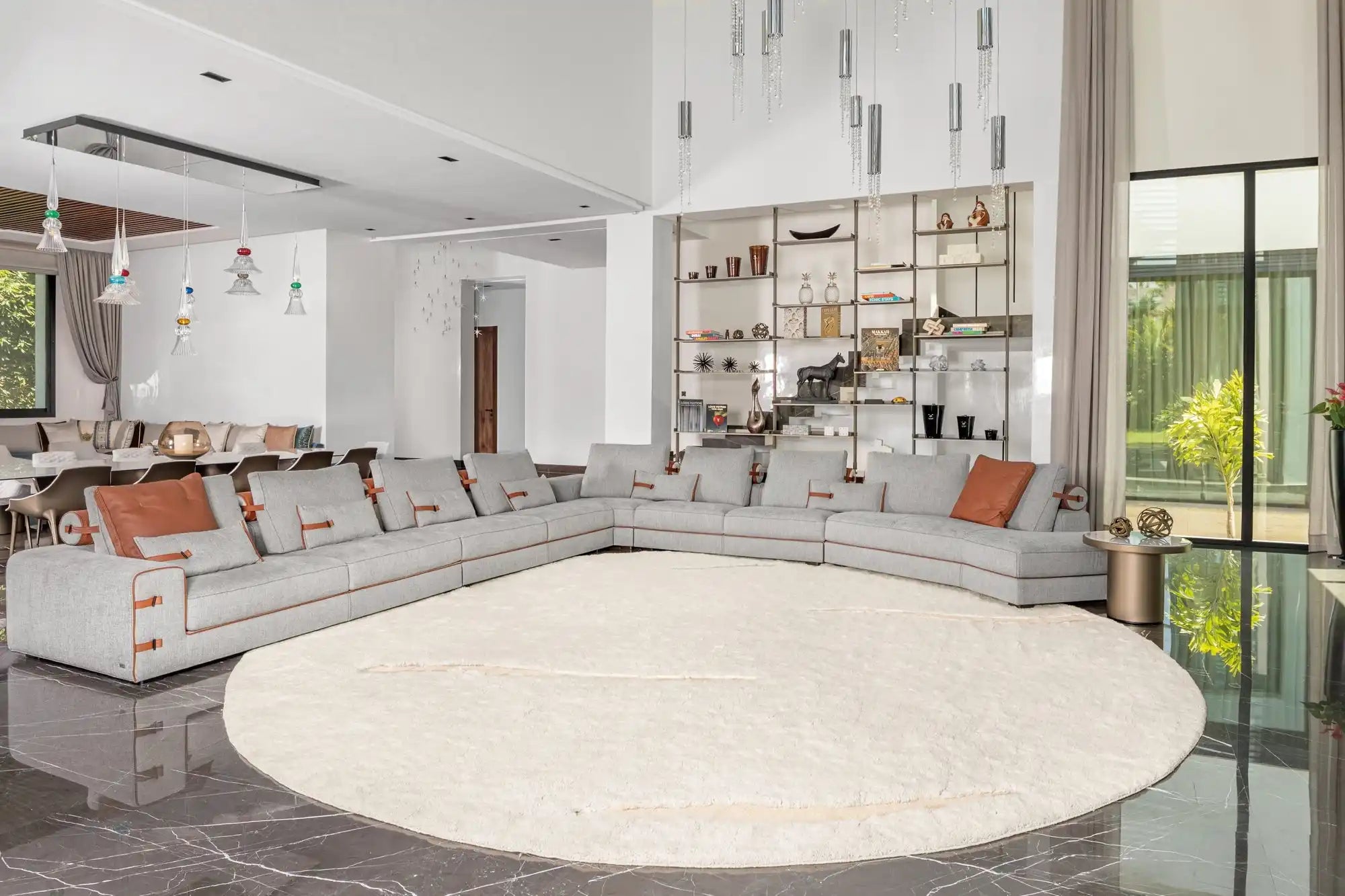Circular white area rug on a dark floor.